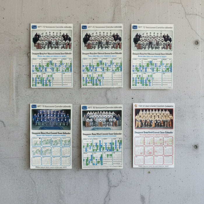 Set of 6 CANUCKS calendars from 1971-1979  on a white background